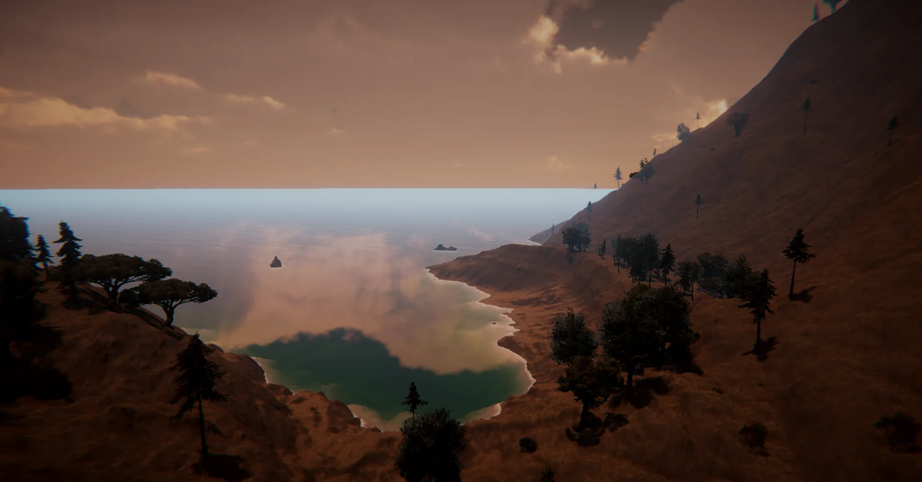 A remote, mountainous island coastline beneath an amber sky.