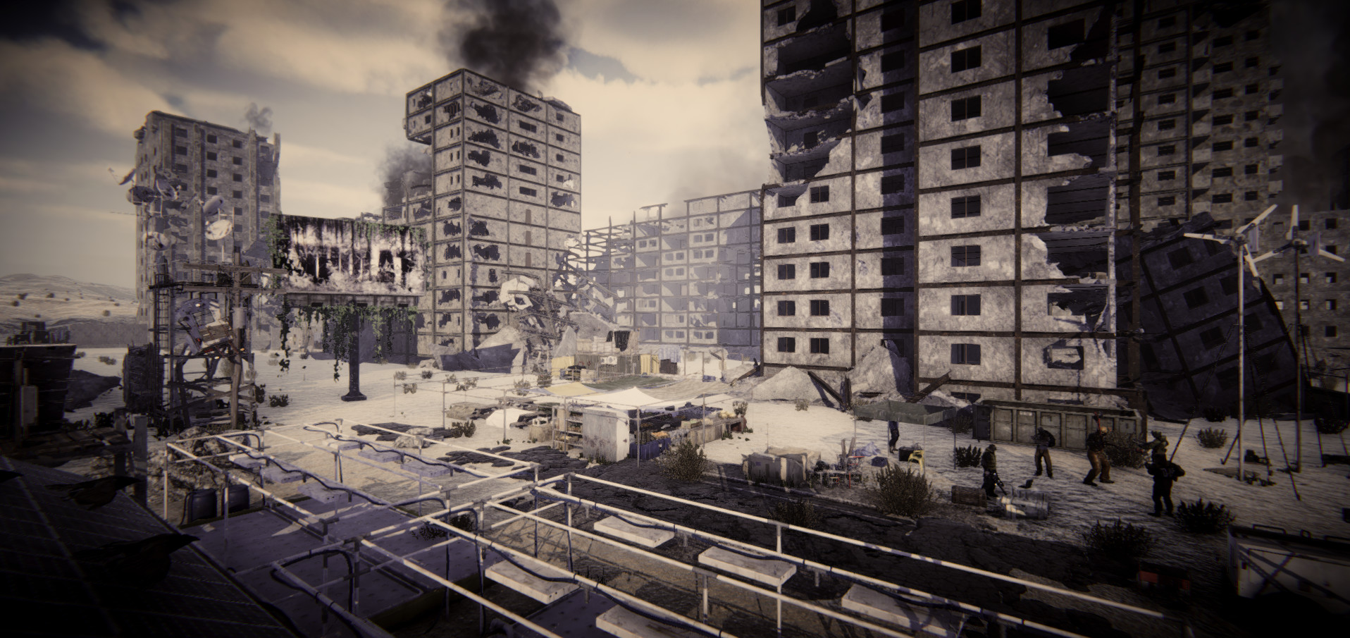 A devastated urban district with shattered concrete buildings and rubble.
